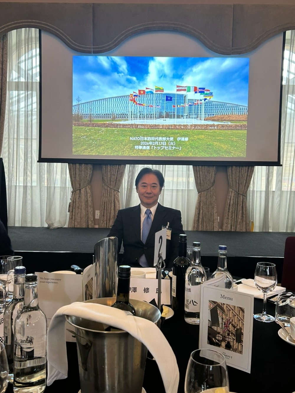 Izawa in front of presentation